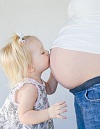 kissing pregnant belly