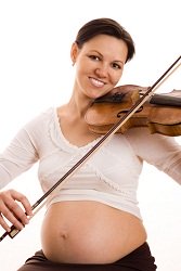 Pregnant woman playing the violin